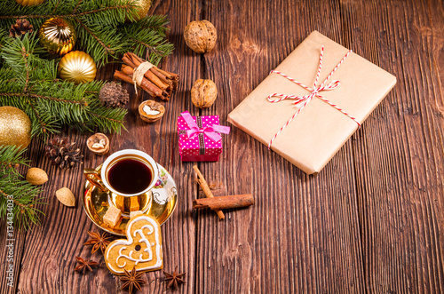 little coffe cup and gift on a christmas decorations photo