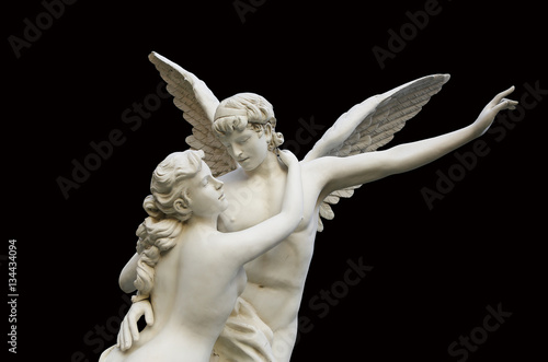 Canvas Print Sculpture of an angel and woman isolated on black background