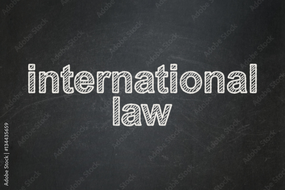 Fototapeta premium Political concept: International Law on chalkboard background