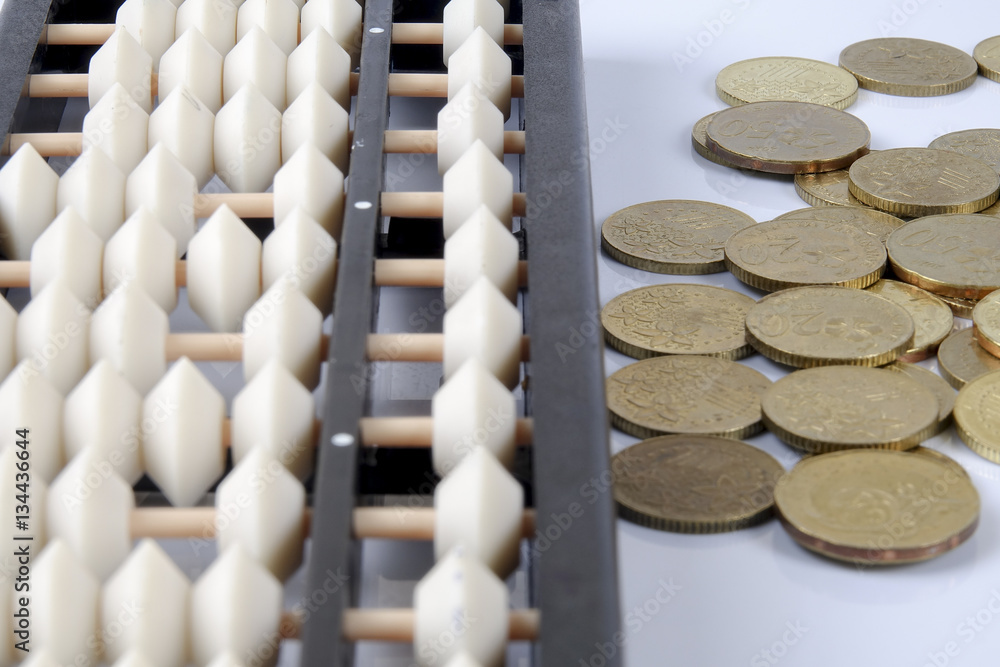 Abacus and coins. Business concept Abacus and coins. Business concept