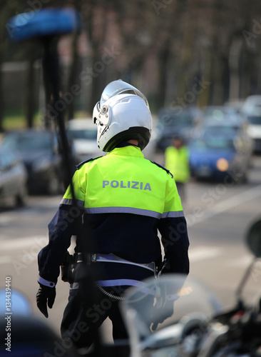 flashing siren of police motorcycle and an italian traffic offic