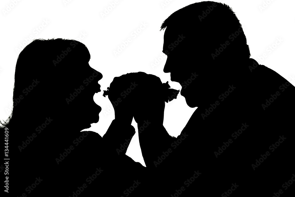 silhouette of a couple eating with an appetite a hamburger