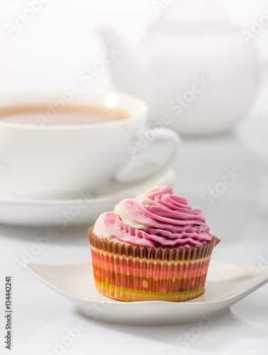 Cupcake on background tea set