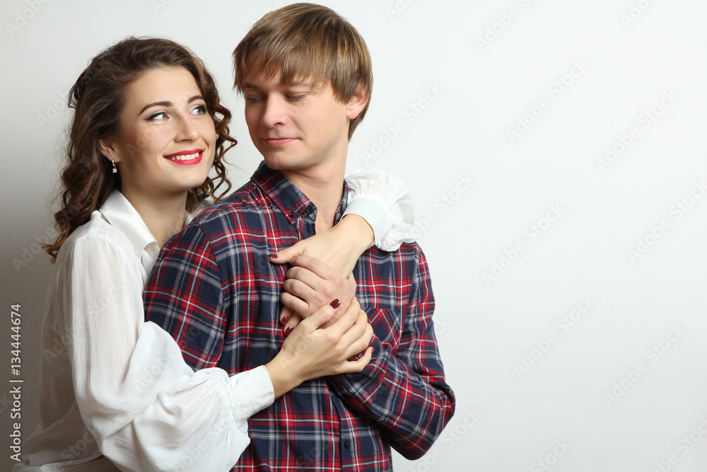 A loving couple posing in studio. A loving couple posing in studio.