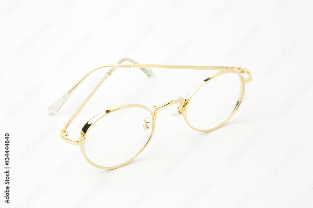 Classic gold round glasses on white background Classic gold round glasses on white background