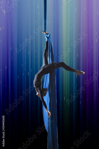 beautiful woman dancing with aerial silk