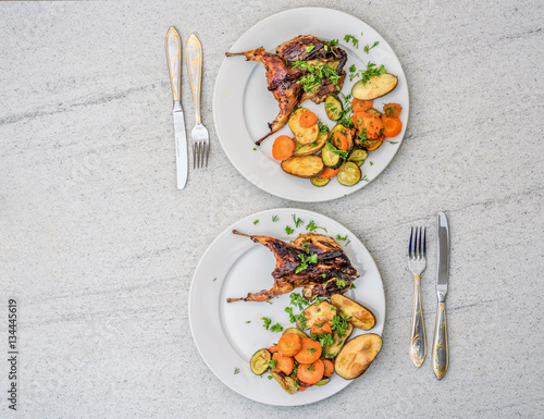 Roasted homemade quail with vegetables. Healthy food. Perfect dinner for two....