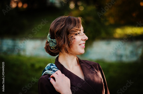 Close up face portrait of smart girl with old-fashioned hairstyl photo