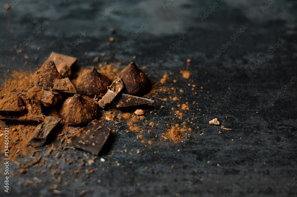 Set of chocolate, truffles and cocoa on rustic background Set of chocolate, truffles and cocoa on rustic background