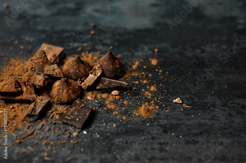 Set of chocolate, truffles and cocoa on rustic background