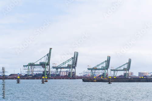 row of harbor cranes