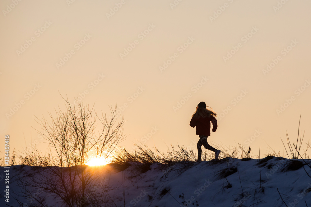 Young girl  running   in snow,  Running sport girl 

