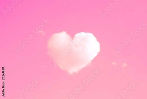 Fototapeta Naklejka Na Ścianę i Meble -  Beautiful clouds in heart shape on pink sky in Vintage style for Happy valentines day or wedding concept and copy space.
