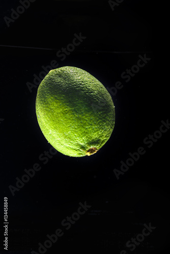 Fresh lime in water isolated on black © Drobot Dean