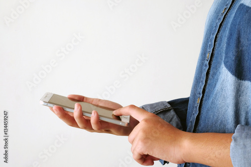 Hand holding smart phone on white background, technology concept, gen Z, digital marketing, lifestyle