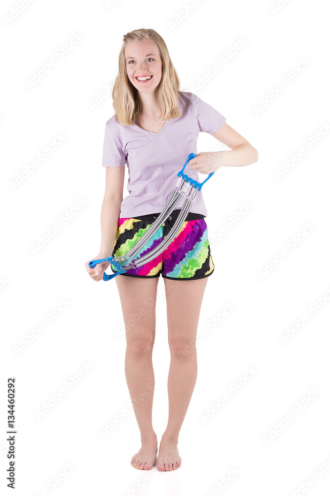 Blond woman doing exercise with expander Blond woman doing exercise with expander