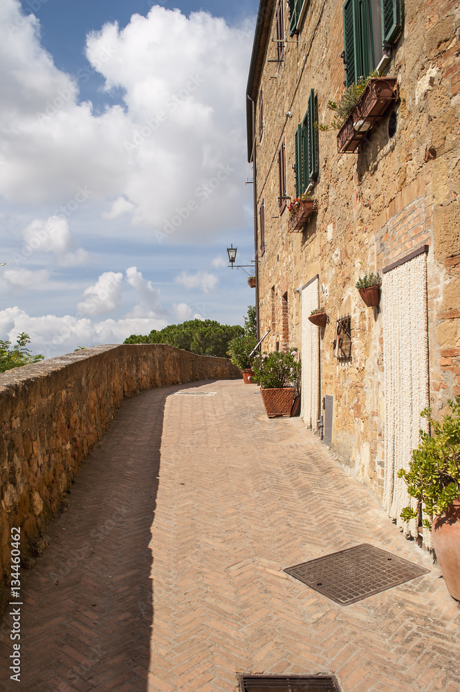 Narrow small town lane in Pienza, Tuscany.