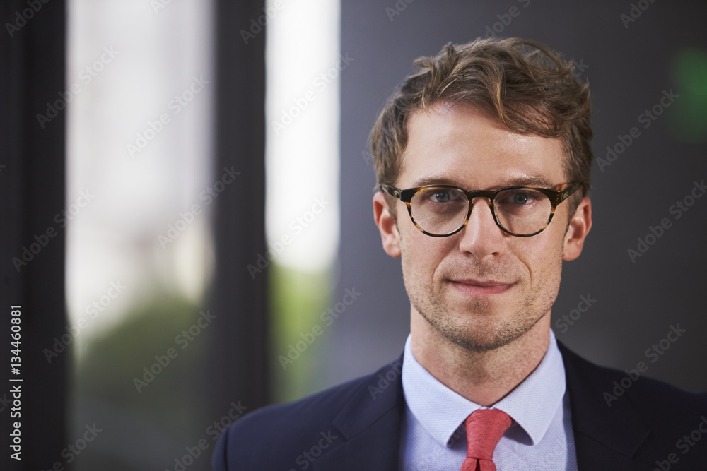 Young white businessman, head and shoulders close up Young white businessman, head and shoulders close up
