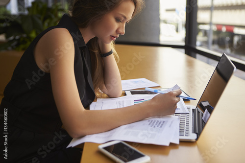 Businesswoman working in office  side view  close up