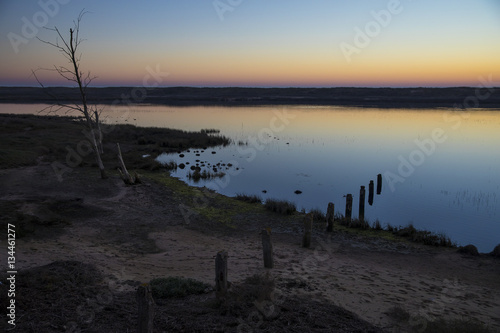 sunset with reflection in still water over nature reserve Casse de la Belle Henriette  Vendee  France