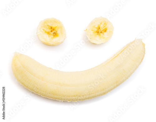 Banana clown with a slice isolated on white background. Flat lay