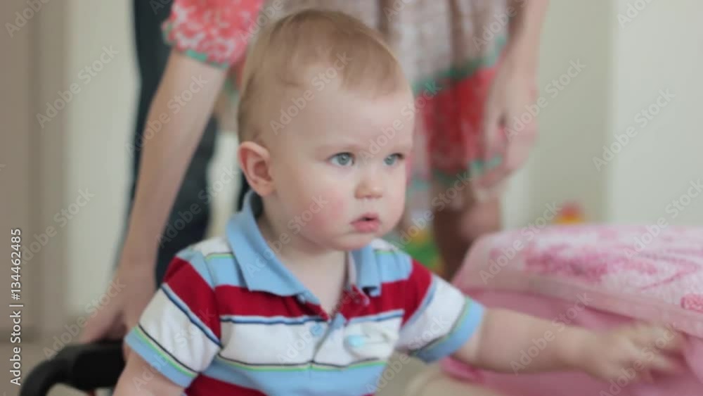 boy riding on a toy car