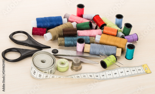 sewing supplies, threads, needles, thimble, scissors