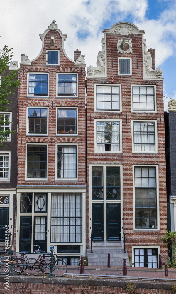 Historical houses at a canal in Amsterdam