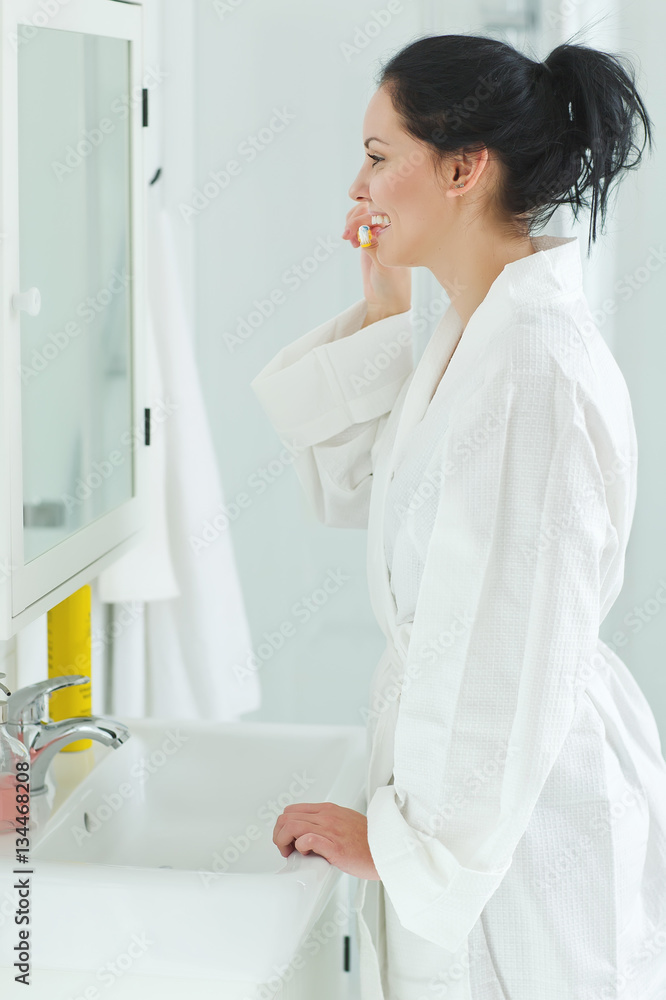 Woman brushing her teeth Woman brushing her teeth