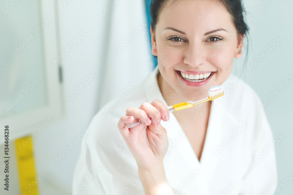 Woman brushing her teeth 