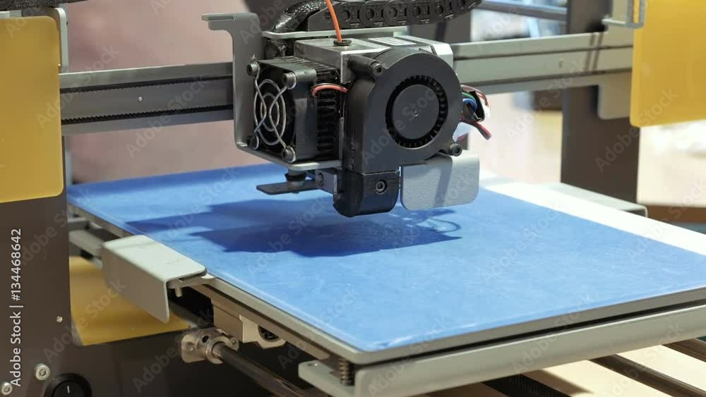 Automatic three dimensional 3d printer performs product creation. Modern 3D printing or additive manufacturing and robotic automation technology. Automatic three dimensional 3d printer performs product creation. Modern 3D printing or additive manufacturing and robotic automation technology.