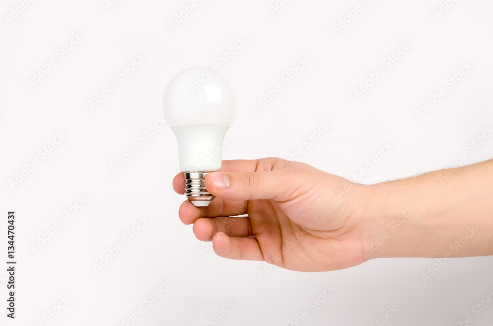man's hand holding the LED lamp man's hand holding the LED lamp