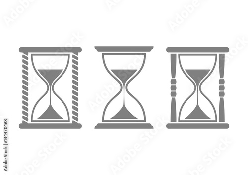 Grey hourglass icons on white background