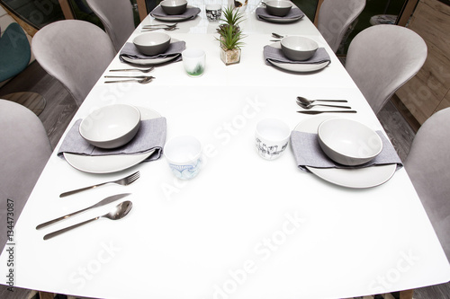 Dining room interior with served table photo