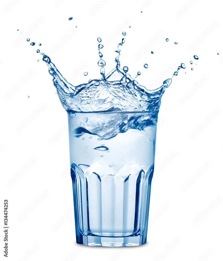 Splashing in the glass of water isolated on white background StockFoto