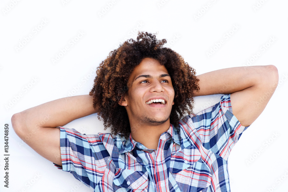 laughing young man with hands behind head laughing young man with hands behind head