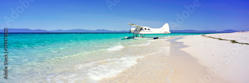 A seaplane on a sand island on the Great Barrier Reef in Australia photo