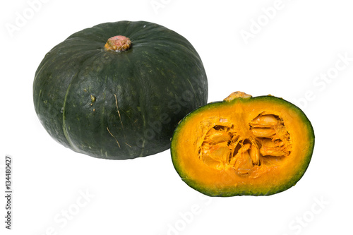 Green pumpkin with pumpkin sliced on white background isolated