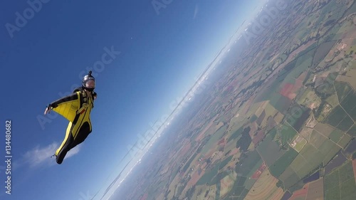 Skydiving wing suit woman acrobatic