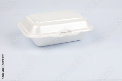 unhealthy polystyrene lunch boxes with take away meal isolated on white background.