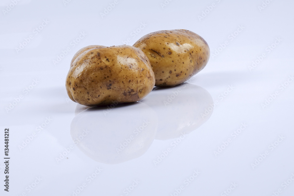Fresh raw potato on white background. Fresh raw potato on white background.