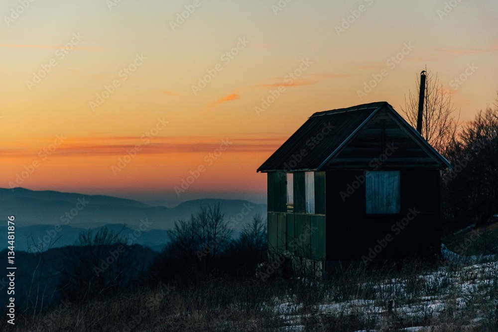 House in mountains with sunset House in mountains with sunset