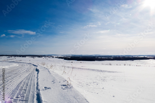 Beautiful and bright Canadian winter landscape during a great sunny day with some clouds. Quebec, Canada.