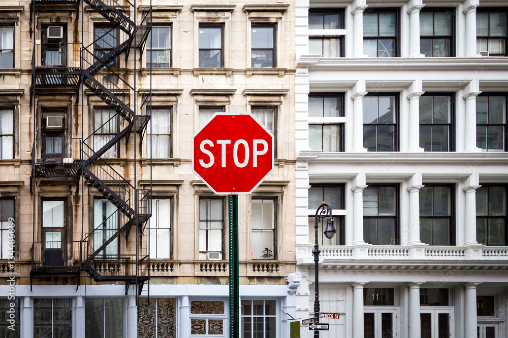 Stop Sign in front of Old Historic Buildings in New York City NYC