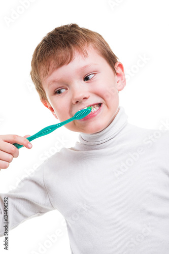 Boy without baby teeth with toothbrush