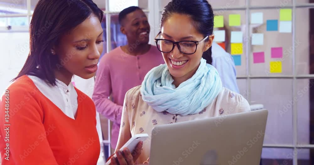 Female business executive discussing over digital tablet in the office 4k Female business executive discussing over digital tablet in the office 4k