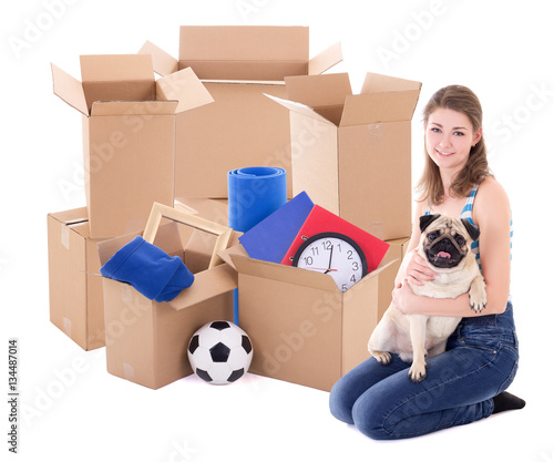 young woman with brown cardboard boxes and dog isolated on white