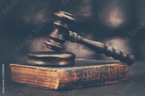 Law gavel on old brown leather book  photo