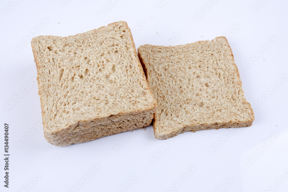 Loaf of wholemeal bread on white background Loaf of wholemeal bread on white background