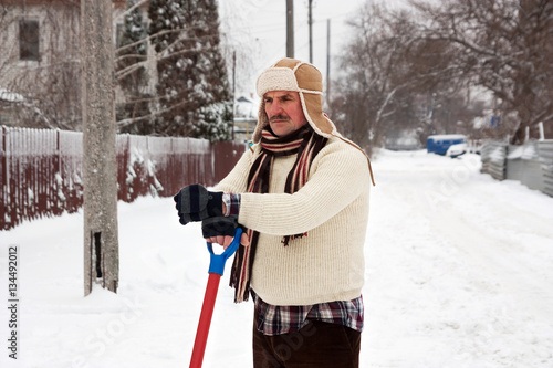 angry man clears snow